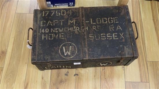 A military tin containing field binoculars and other militaria